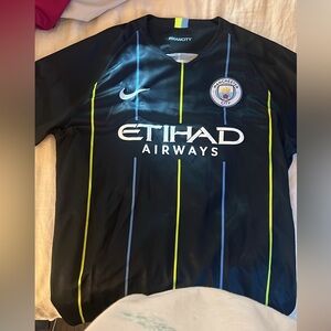 Nike Black Manchester City Jersey with Blue and Yellow Stripes